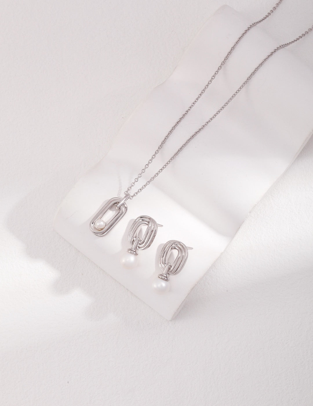Infinite Loop Pearl Drop Earrings